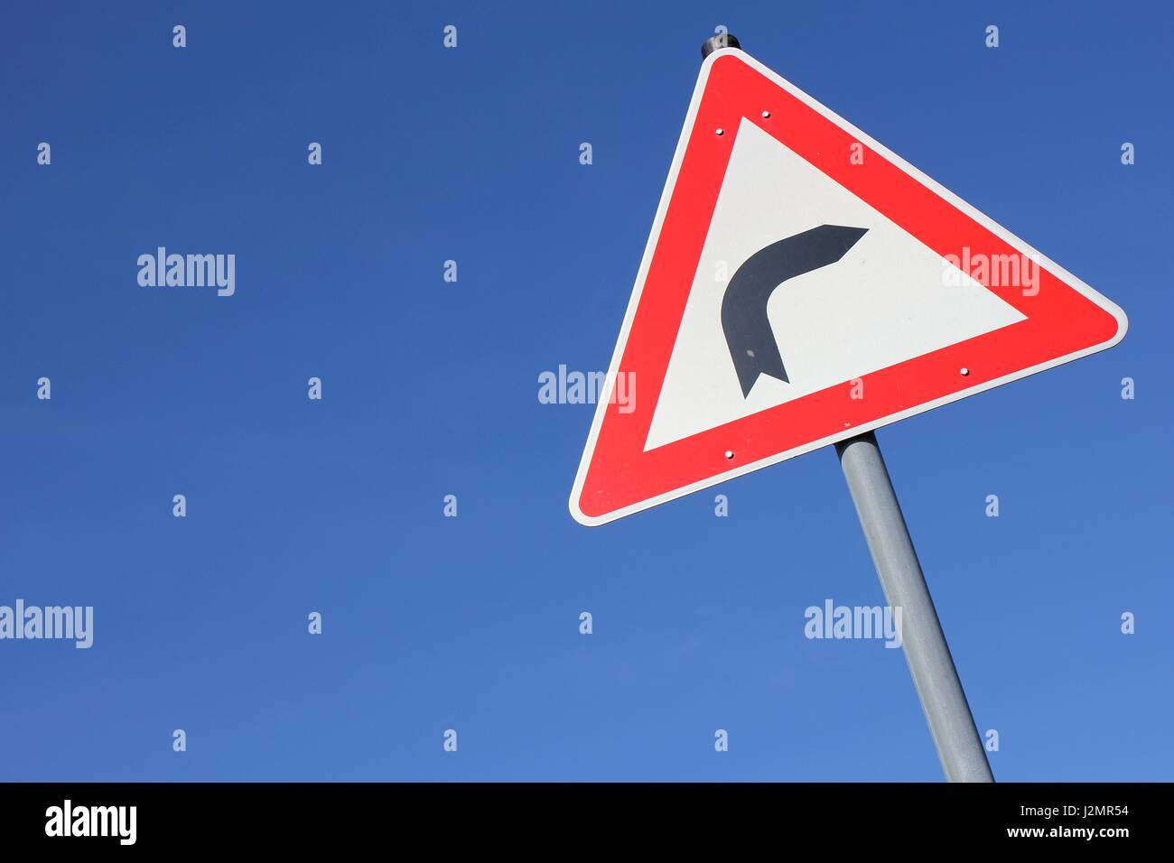 German road sign: dangerous curve Stock Photo