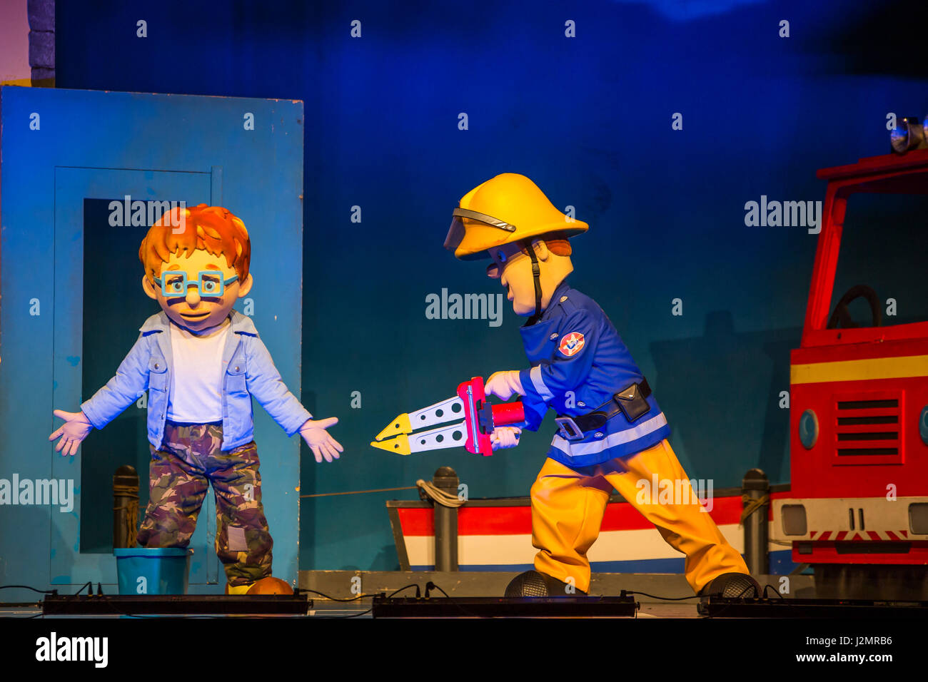 Wetzlar, Germany. 27th April, 2017. Feuerwehrmann Sam Live: Pontypandy rockt!, German children's theater adaptation of Welsh-British animated comedy children's television series Fireman Sam by Theater auf Tour Darmstadt/Germany (in cooperation with Van Hoorne Entertainment, Netherlands). Performance at Stadthalle Wetzlar. Characters in scene: The boy Norman Price is saved by Fireman Sam. --- Fotocredit: Christian Lademann Stock Photo