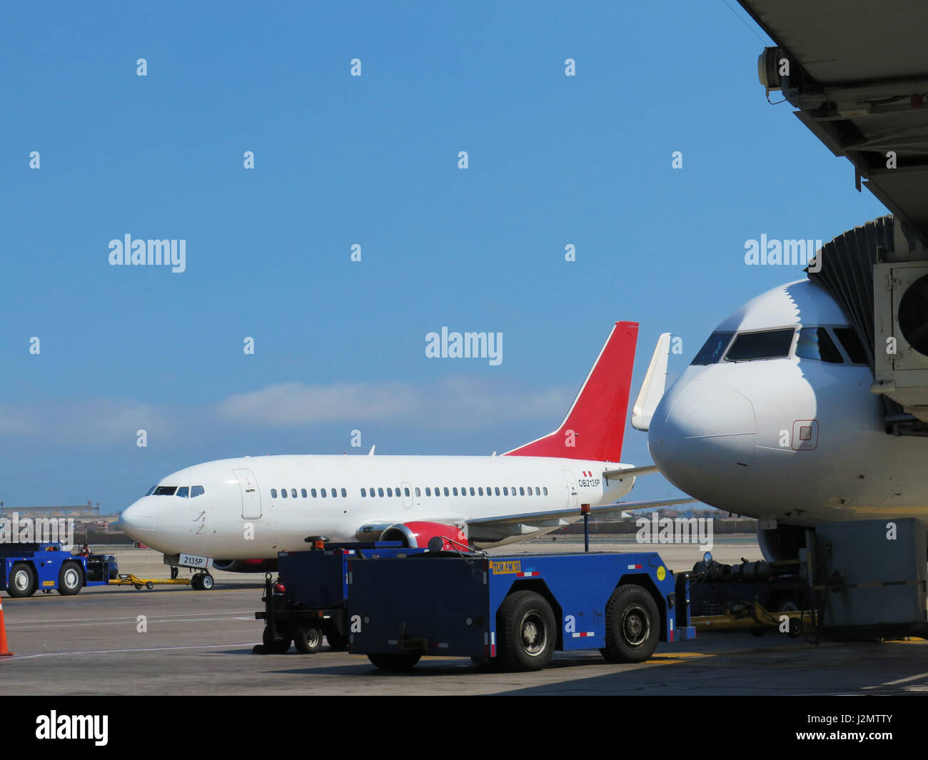 Aerobridge in plane parked in the airport waiting for passengers Stock Photo