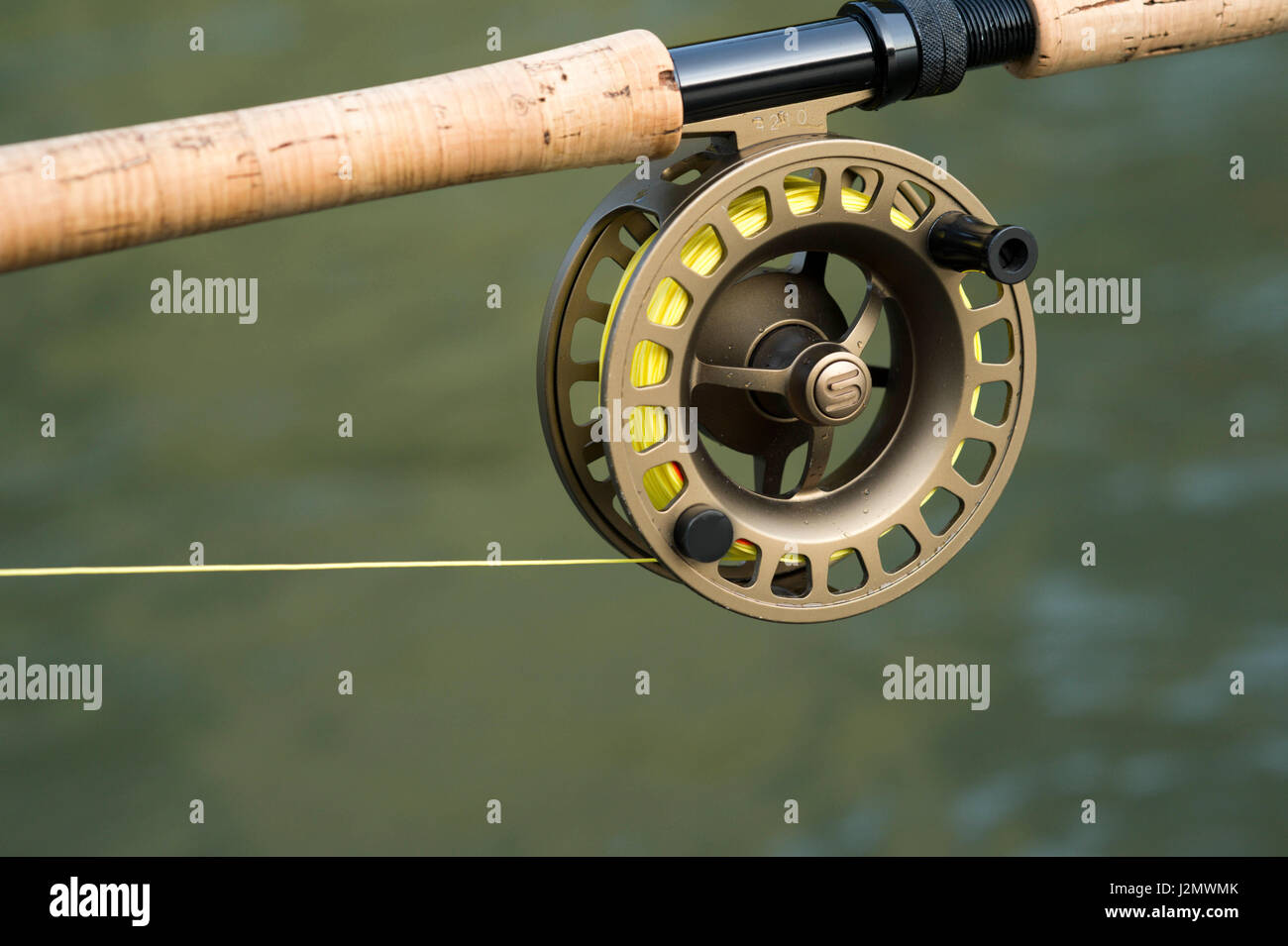 Close up of a fly fishing reel on a rod Stock Photo