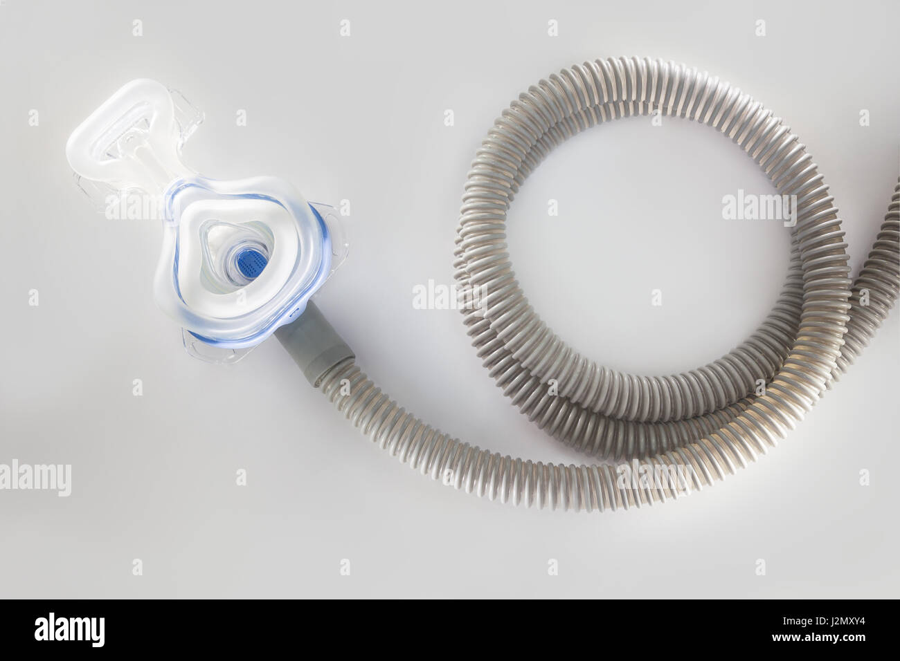 CPAP machine mask and hose, for people with sleep apnea, respiratory, or breathing disorder Stock Photo