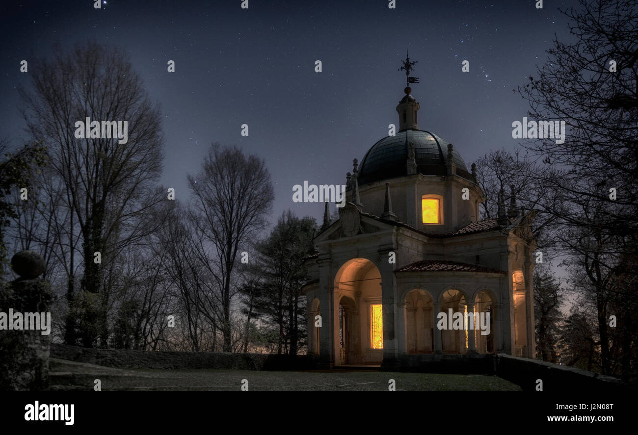 A chapel in the winter night with blue sky in the background, Sacred Mount of Varese - Lombardy, Italy Stock Photo