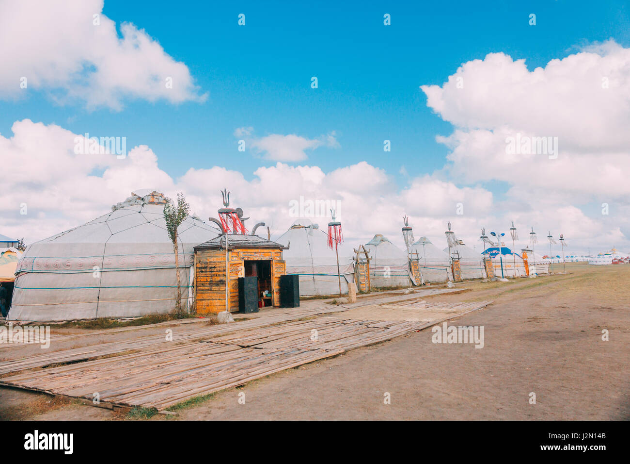 Landscapes of Mongolia, yurts against the backdrop of blue sky Stock Photo