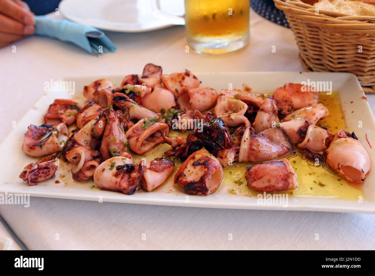 cooked squid on plate Stock Photo - Alamy