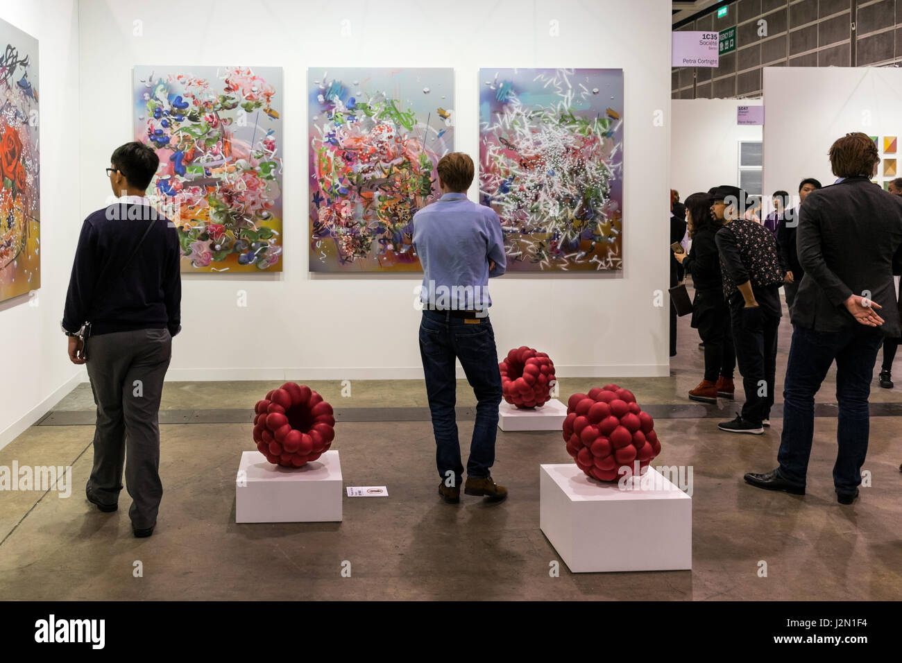 Art gallery visitors looking at paintings Stock Photo Alamy