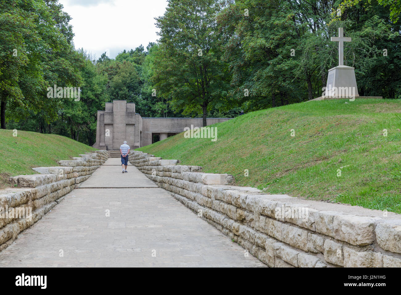 VERDUN, FRANCE - AUGUST 19, 2016:  Old man is visiting the First World War One memorial Trench of Bayonets at Douaumont Stock Photo