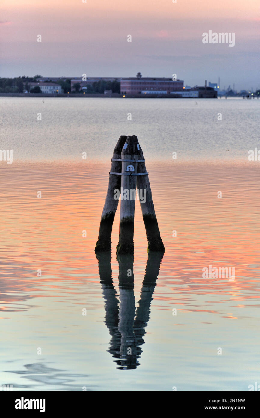 romantic view of the lagoon of Venice seen from the shore, at sunset ...