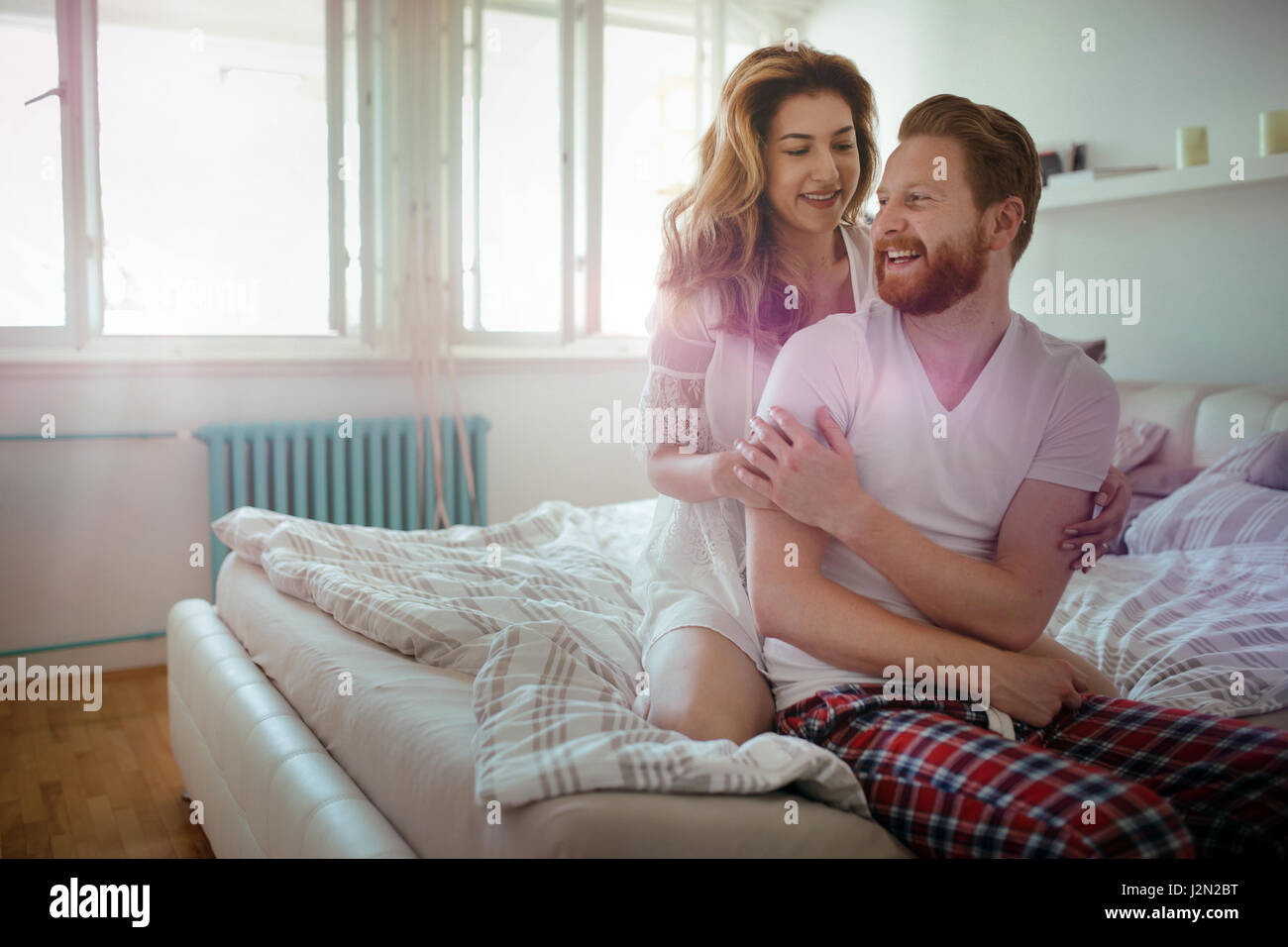 Beautiful Happy And Romantic Couple Waking Up Smiling In