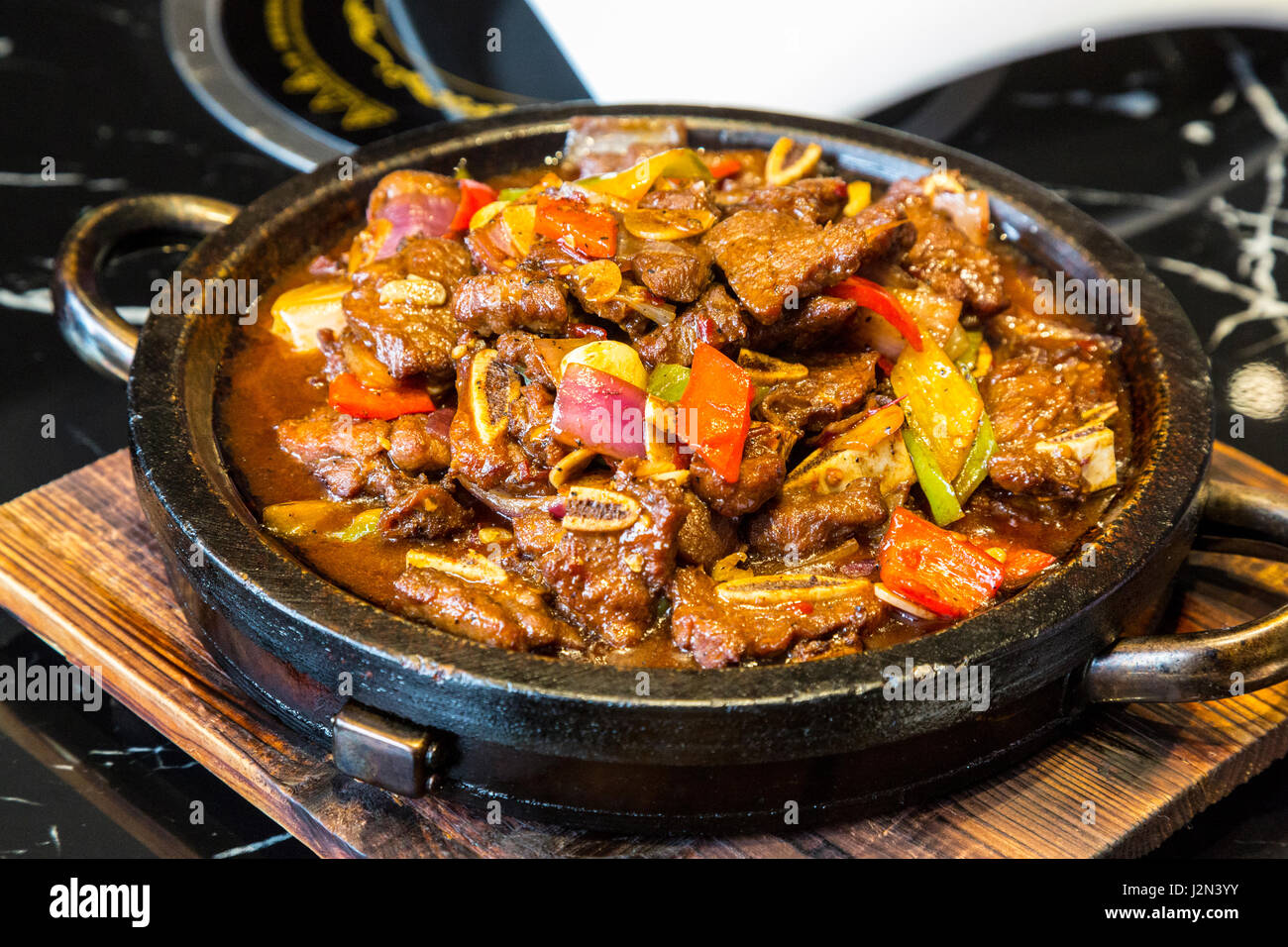 Guizhou, China.  Lunch of Sweet and Sour Pork and vegetables. Stock Photo