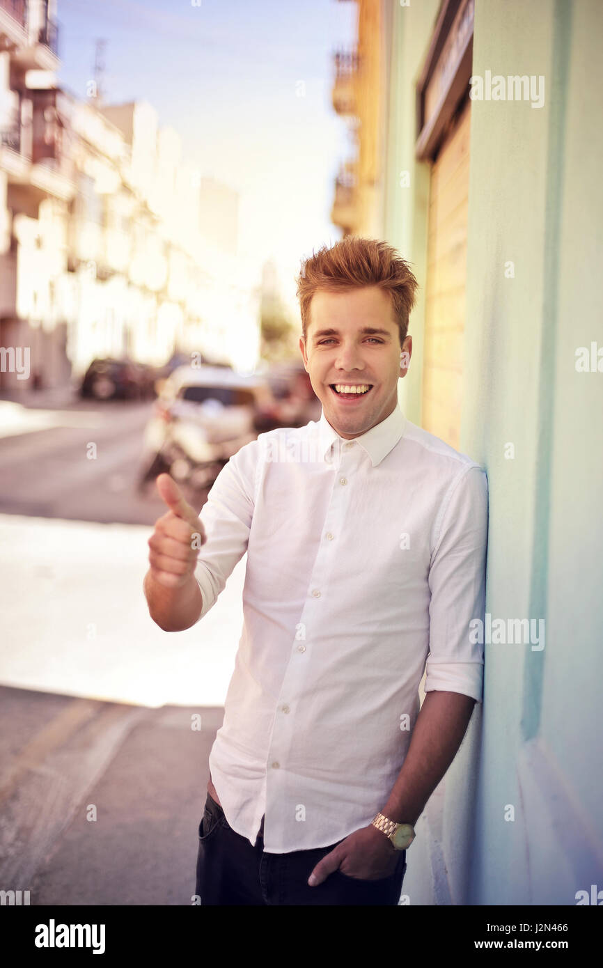 Young man showing like sign Stock Photo