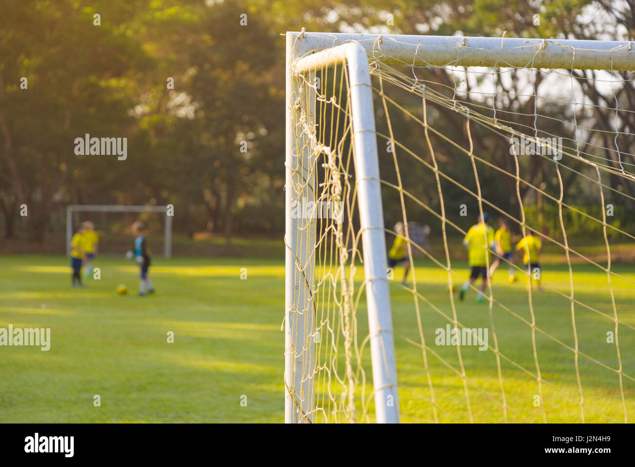 Corner Of A Soccer Or Football Goal Post With Warm Morning Light And Blurred Players And Field In Background Stock Photo Alamy Corner Of A Soccer Or Football Goal Post With Warm Morning Light And Blurred Players And Field In Background Stock Photo Alamy