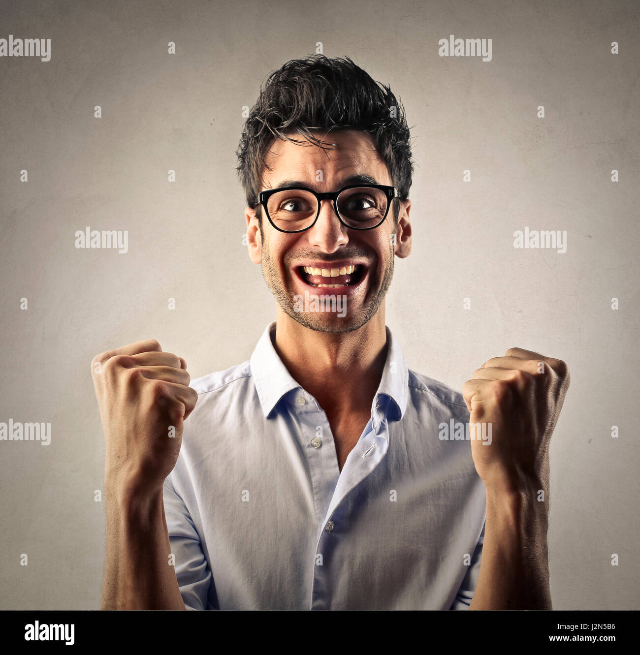Young businessman cheering Stock Photo