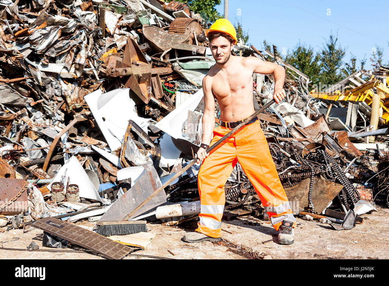 young worker in a junkyard Stock Photo Alamy