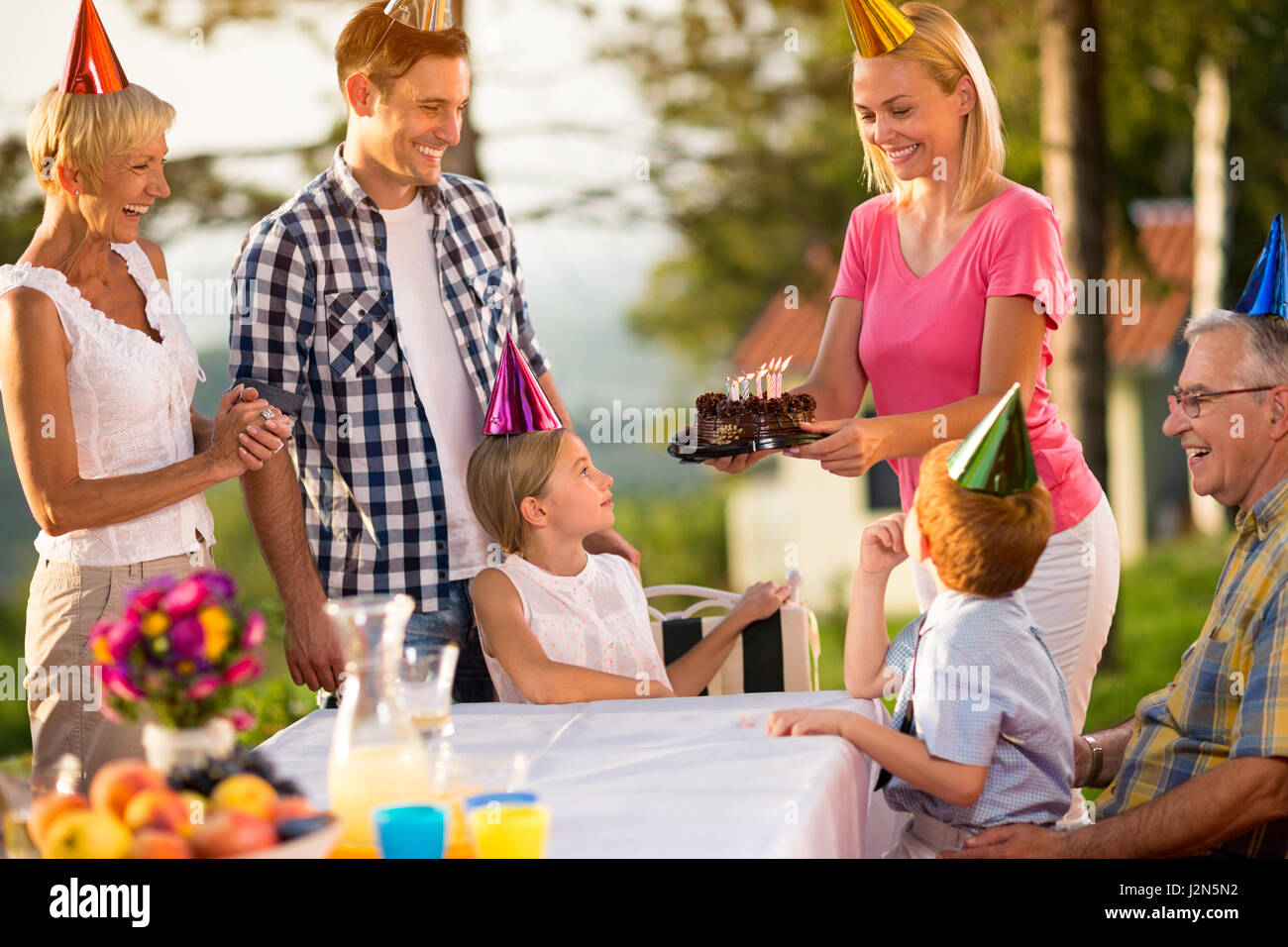 birthday cake for girl and  happy family Stock Photo