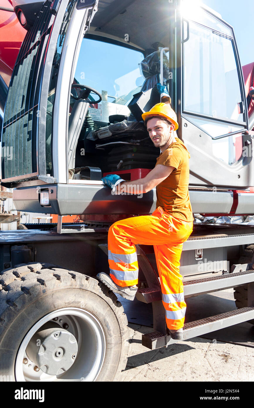 driver gets on his truck in landfill Stock Photo Alamy