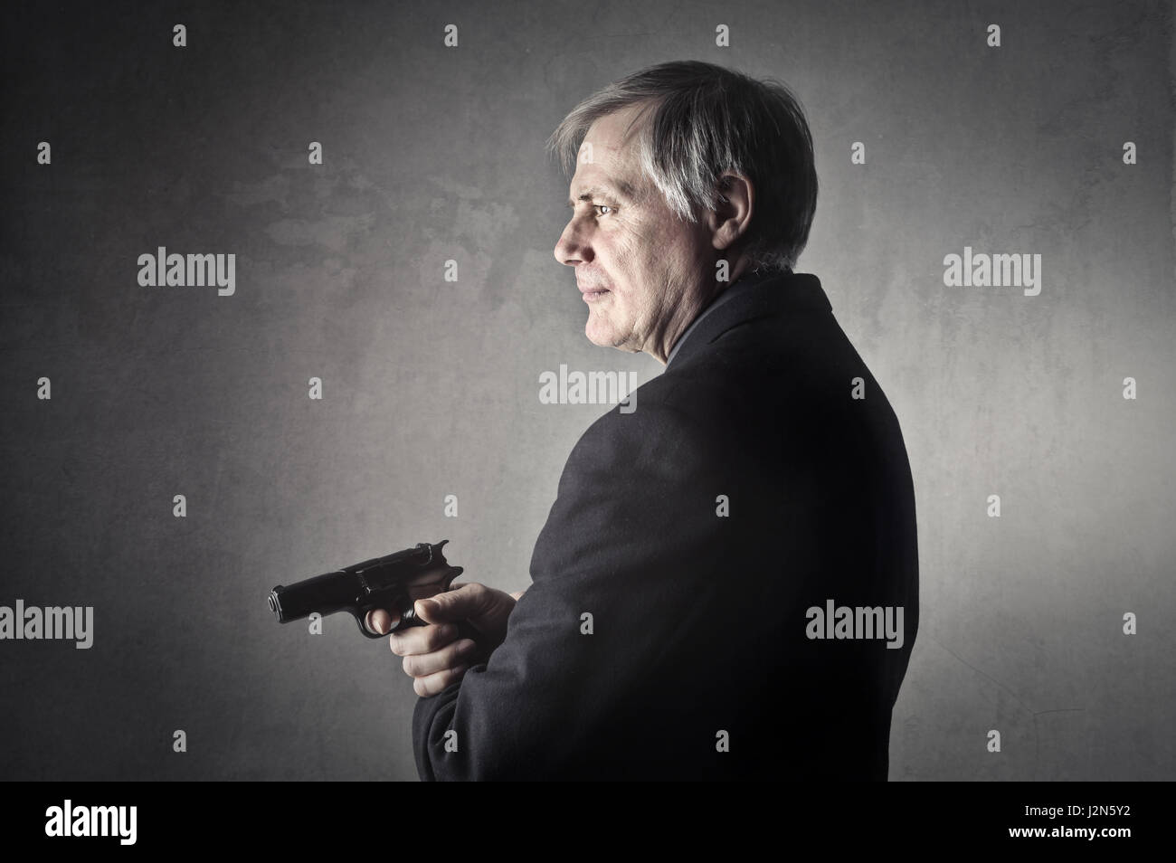 Man with a gun. Man with gun photos. gun photographers.