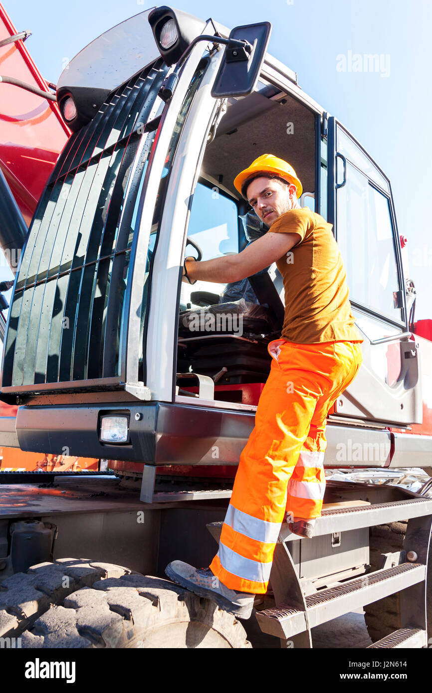 driver gets on his truck in landfill Stock Photo Alamy