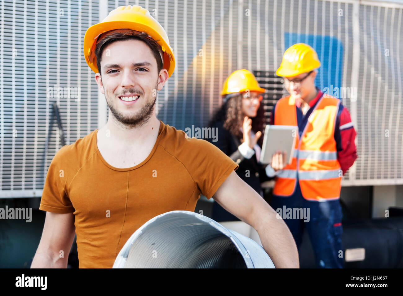 young workers in a junkyard Stock Photo Alamy