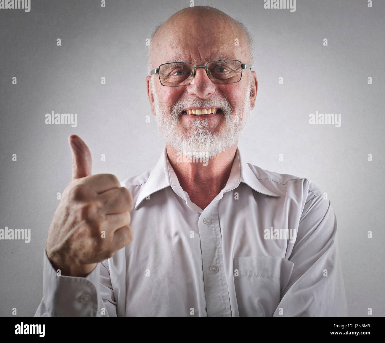 Old man showing like sign Stock Photo