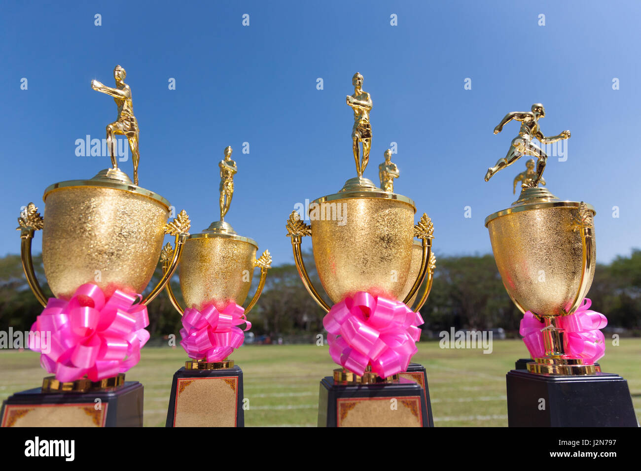 Track and Field trophies, outdoor on a bright sunny day with selective