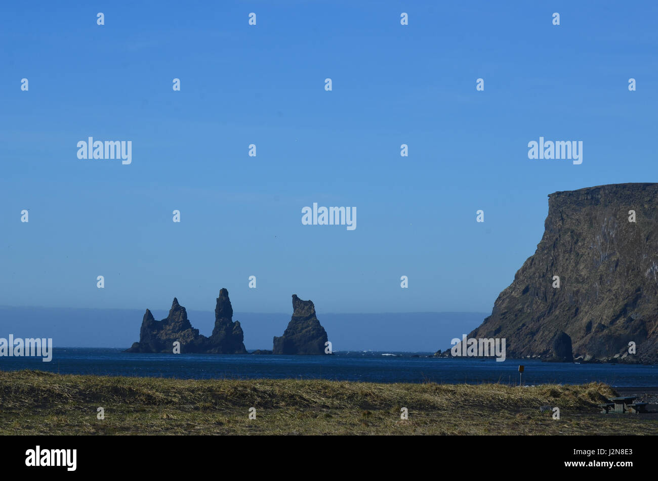 Fantastic towering sea stacks off the coast of Vik Iceland Stock Photo ...