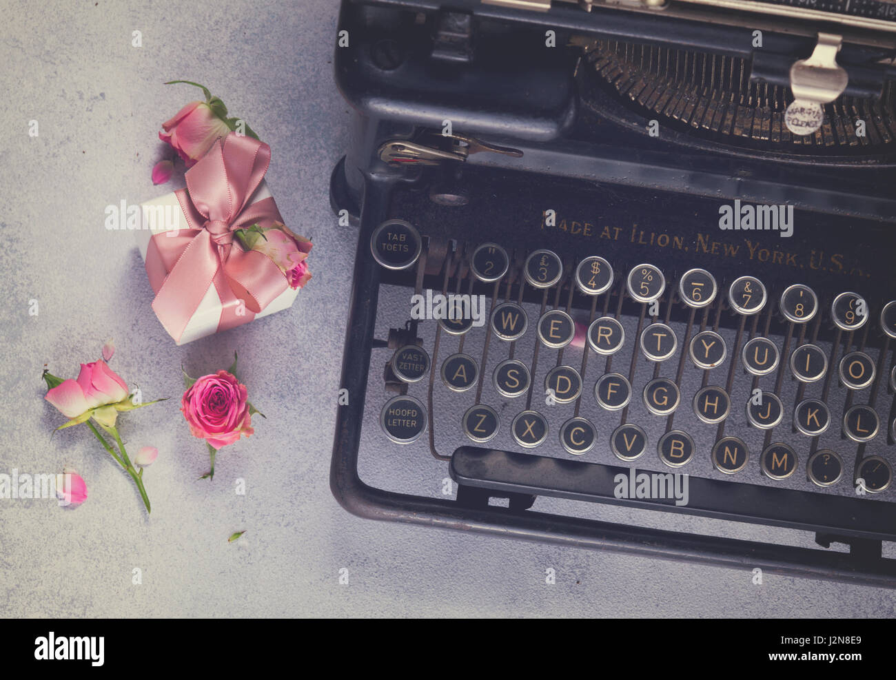 Workspace With Black Vintage Typewriter And Gift Box On Gray