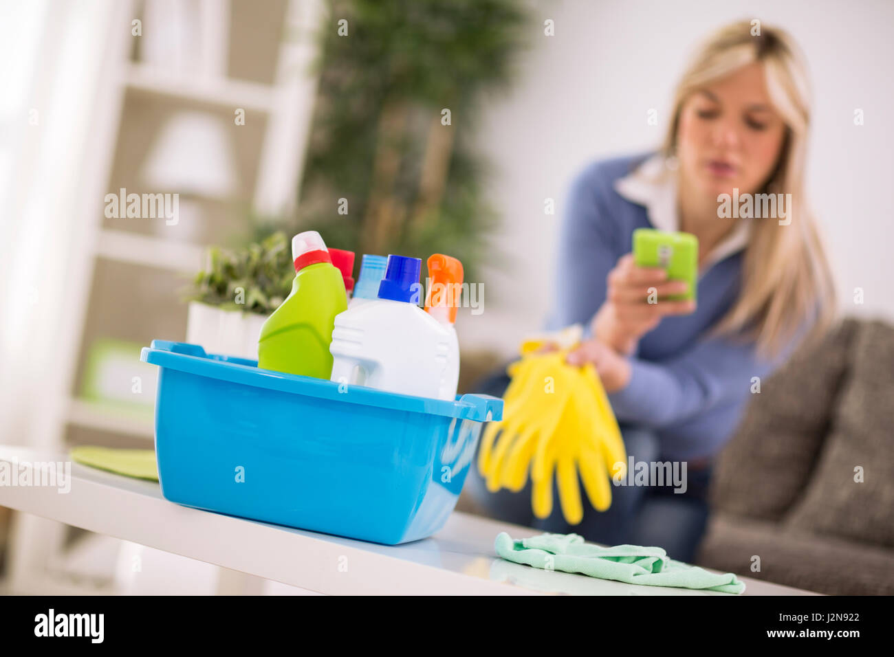 Short rest from cleaning house for cell phone Stock Photo