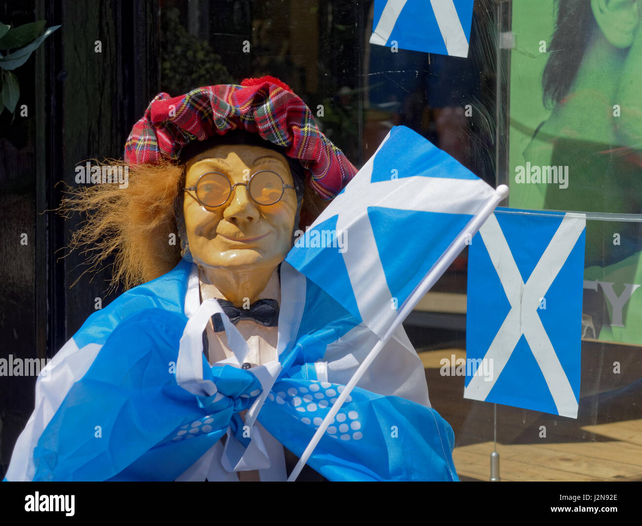 SNP Scottish National Party yes vote brexit independence vote election manikin dressed in  tartan hat satire st Andrews flags and jimmy wig Stock Photo