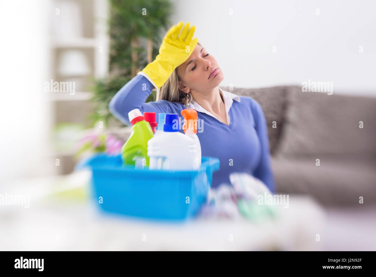 Housewife have headache of hardworking spring cleaning and evaporation