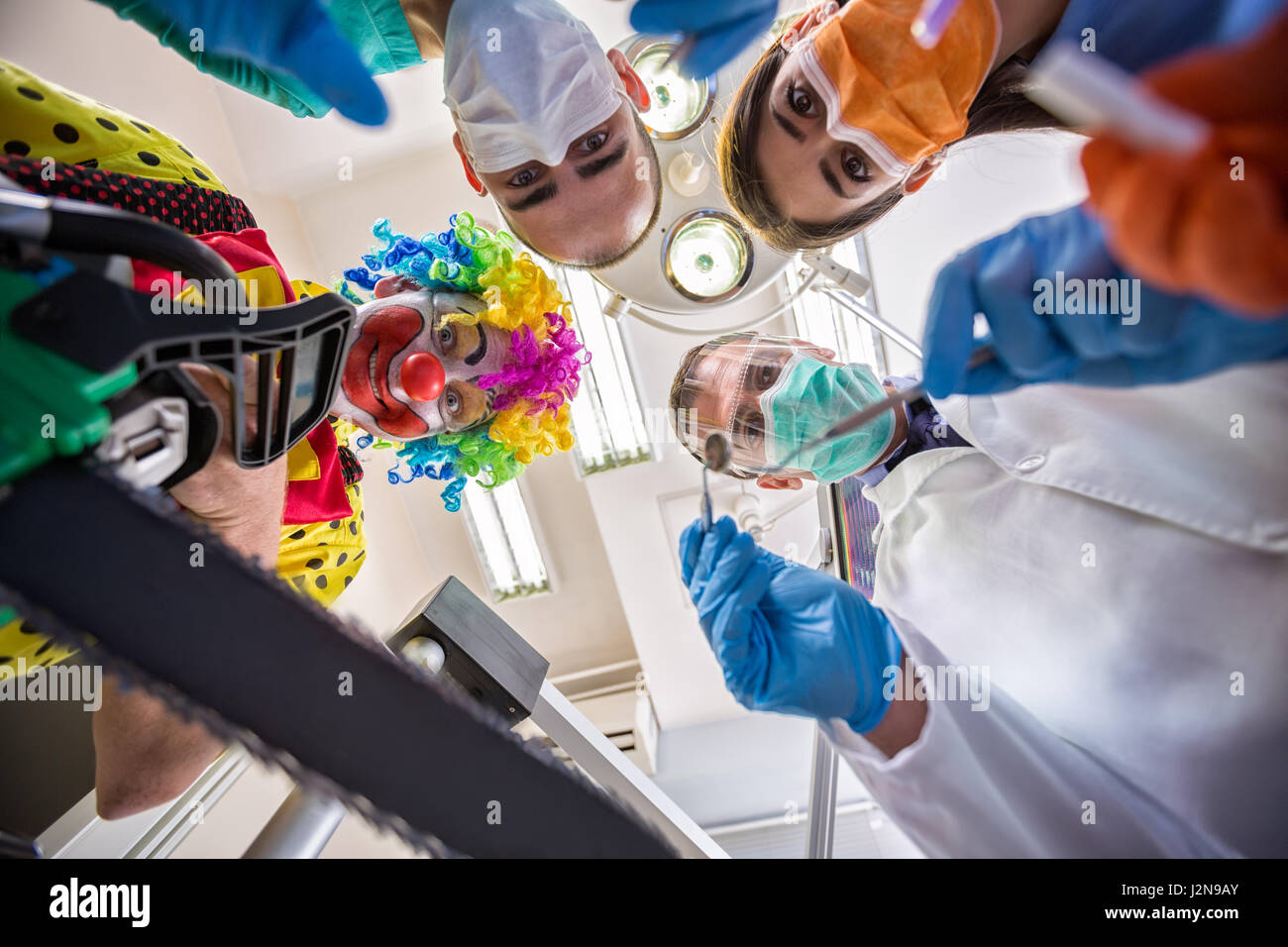 Unusual dental treatment with scary clown from horror in bottom view Stock Photo Alamy