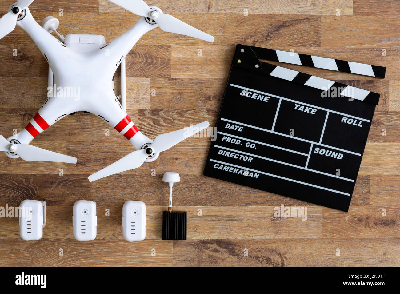 flying drone with camera on wooden table Stock Photo