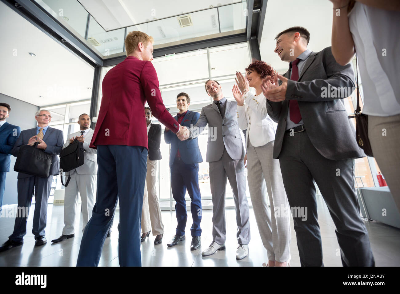 Leader congratulate to his worker and give him recognition for success Stock Photo