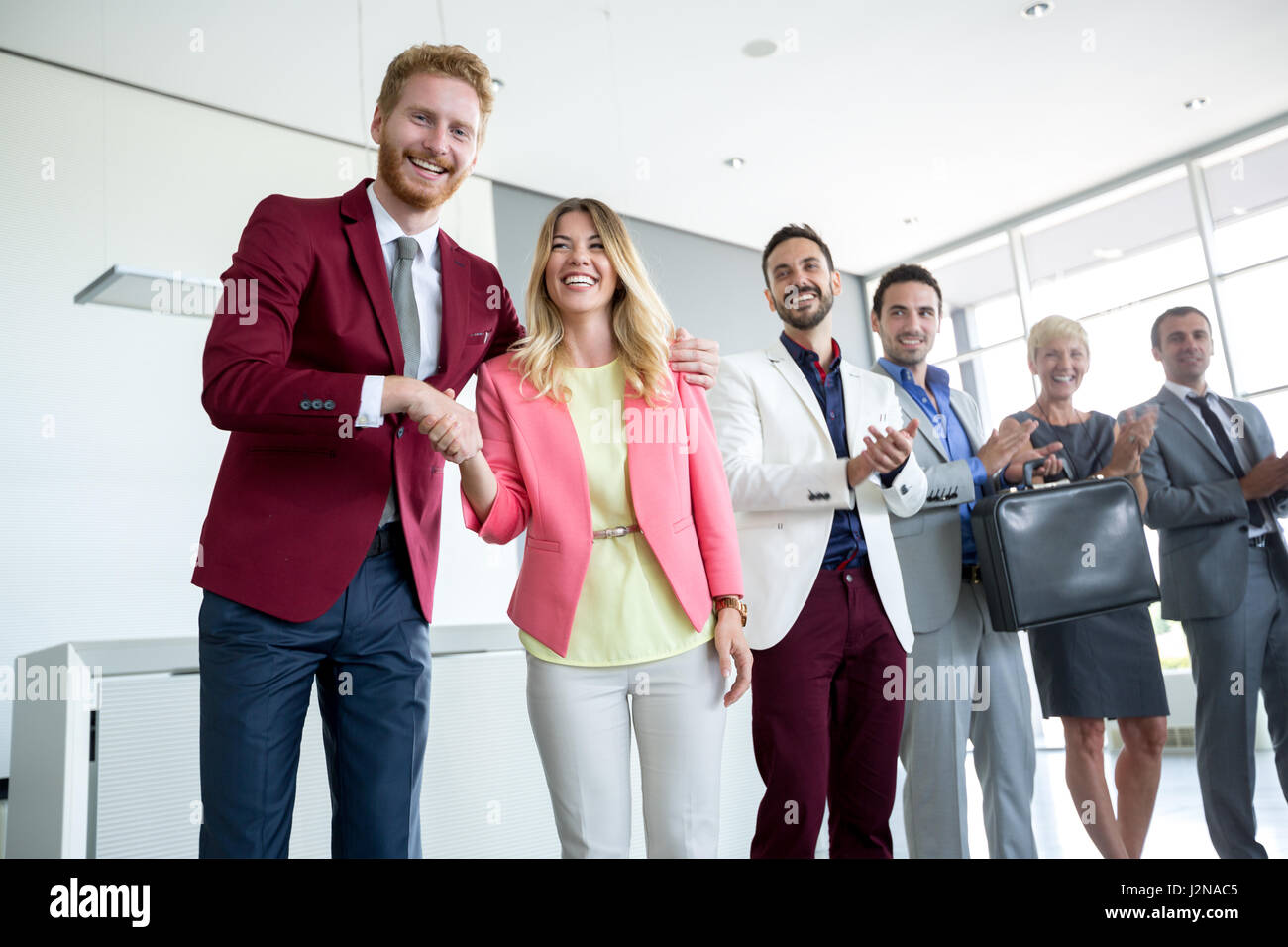 Satisfied director congratulate to his female employer Stock Photo