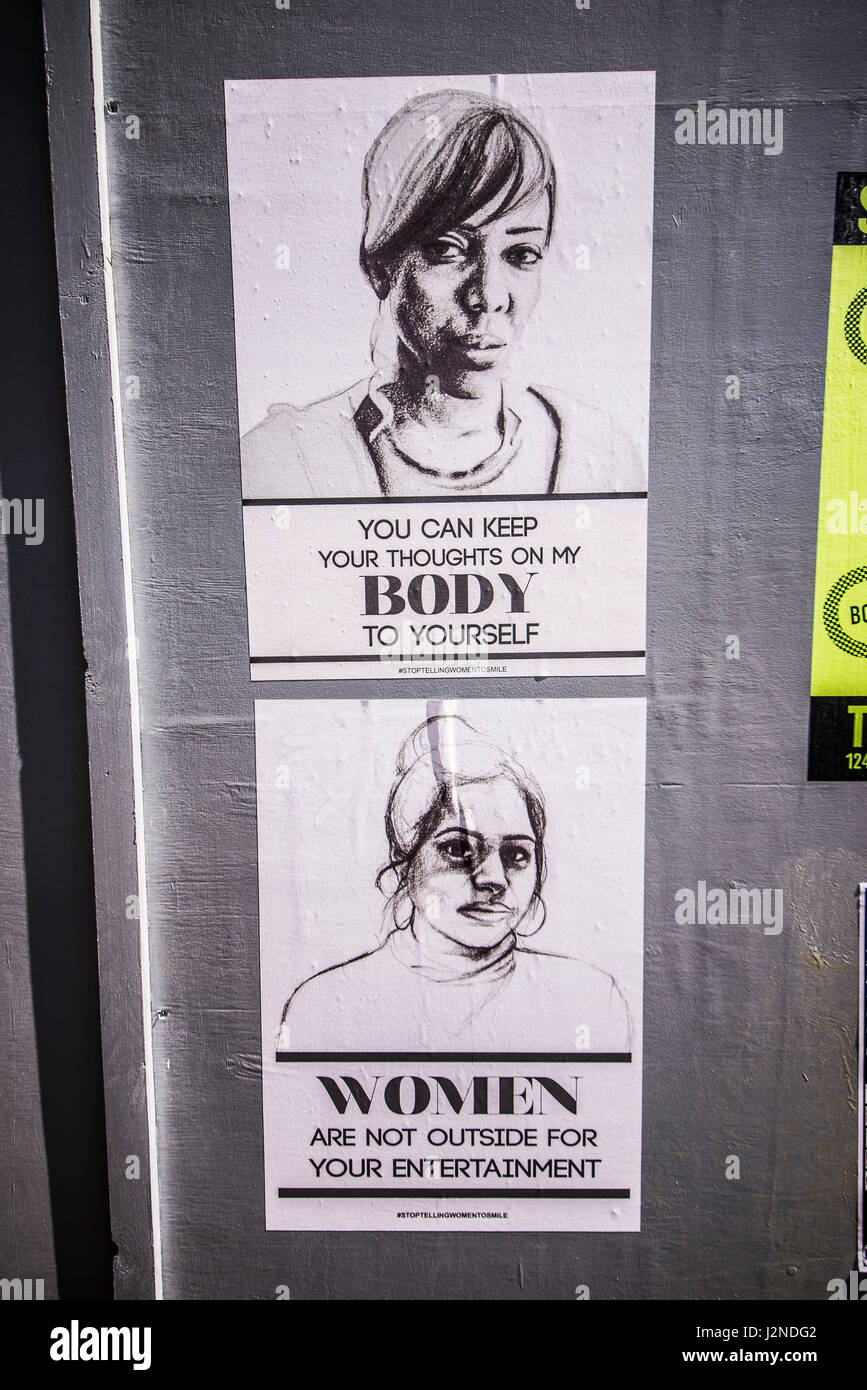 Slogan posters against sexism and attitudes towards women. Black on white drawings with a printed messages from stop telling women to smile campaign Stock Photo