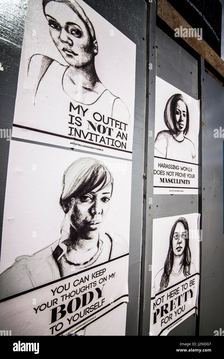 Slogan posters against sexism and attitudes towards women. Black on white drawings with a printed messages from stop telling women to smile campaign Stock Photo