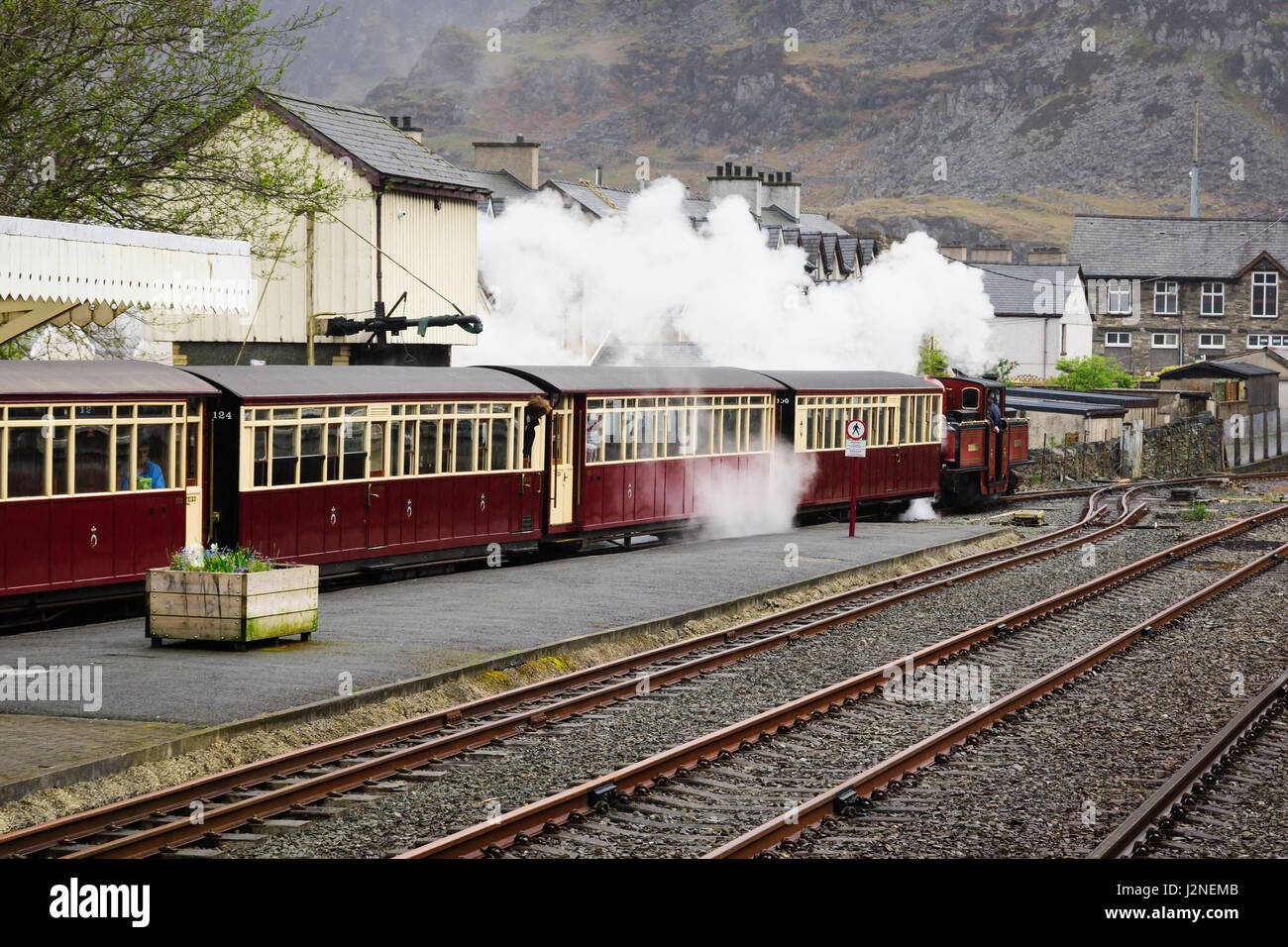 A narrow gauge steam pulls out the station at Blaenau