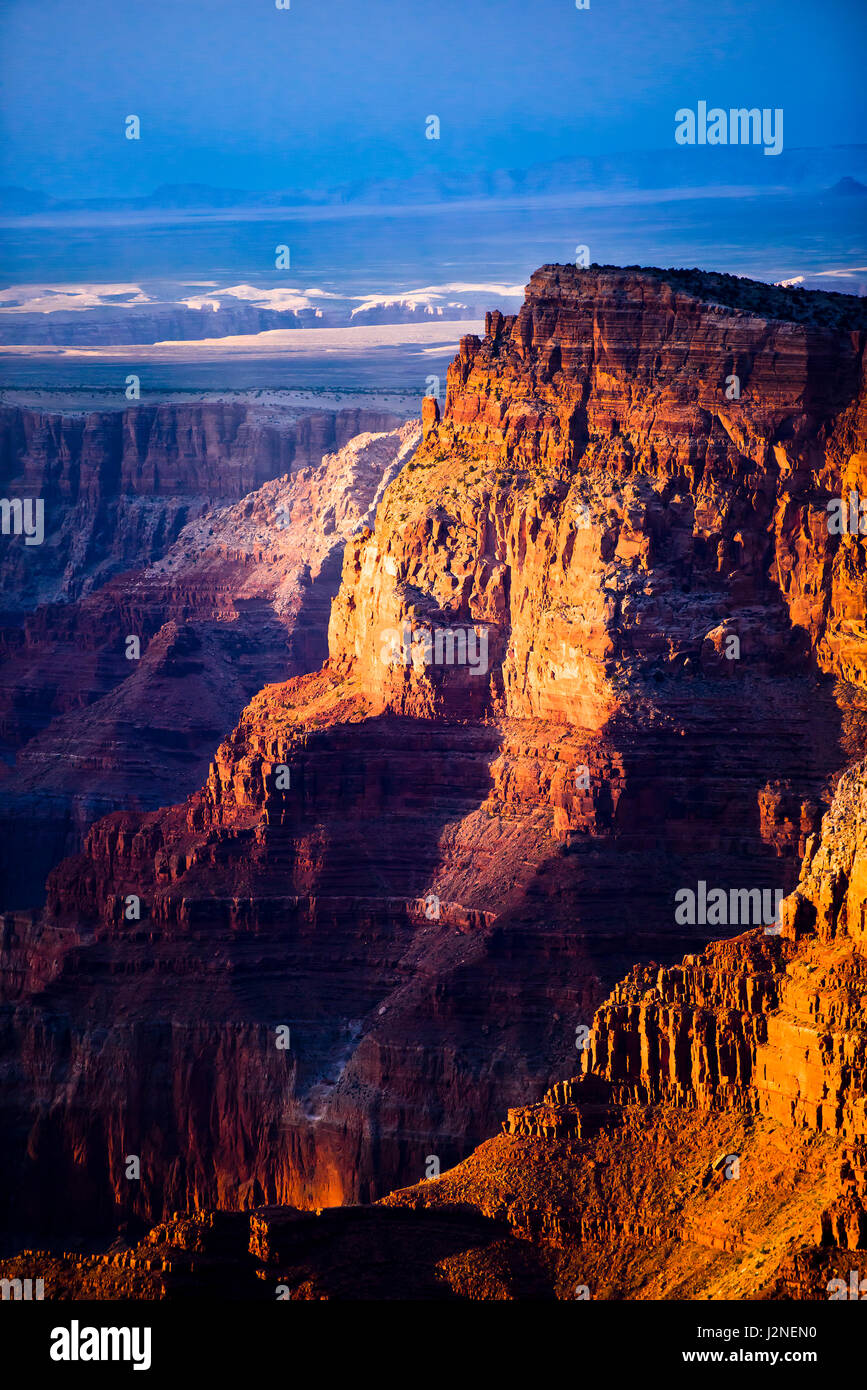 Hillside of the Grand Canyon,Arizona, with orange and brown send rocks at sunset. Blue sky. Stock Photo