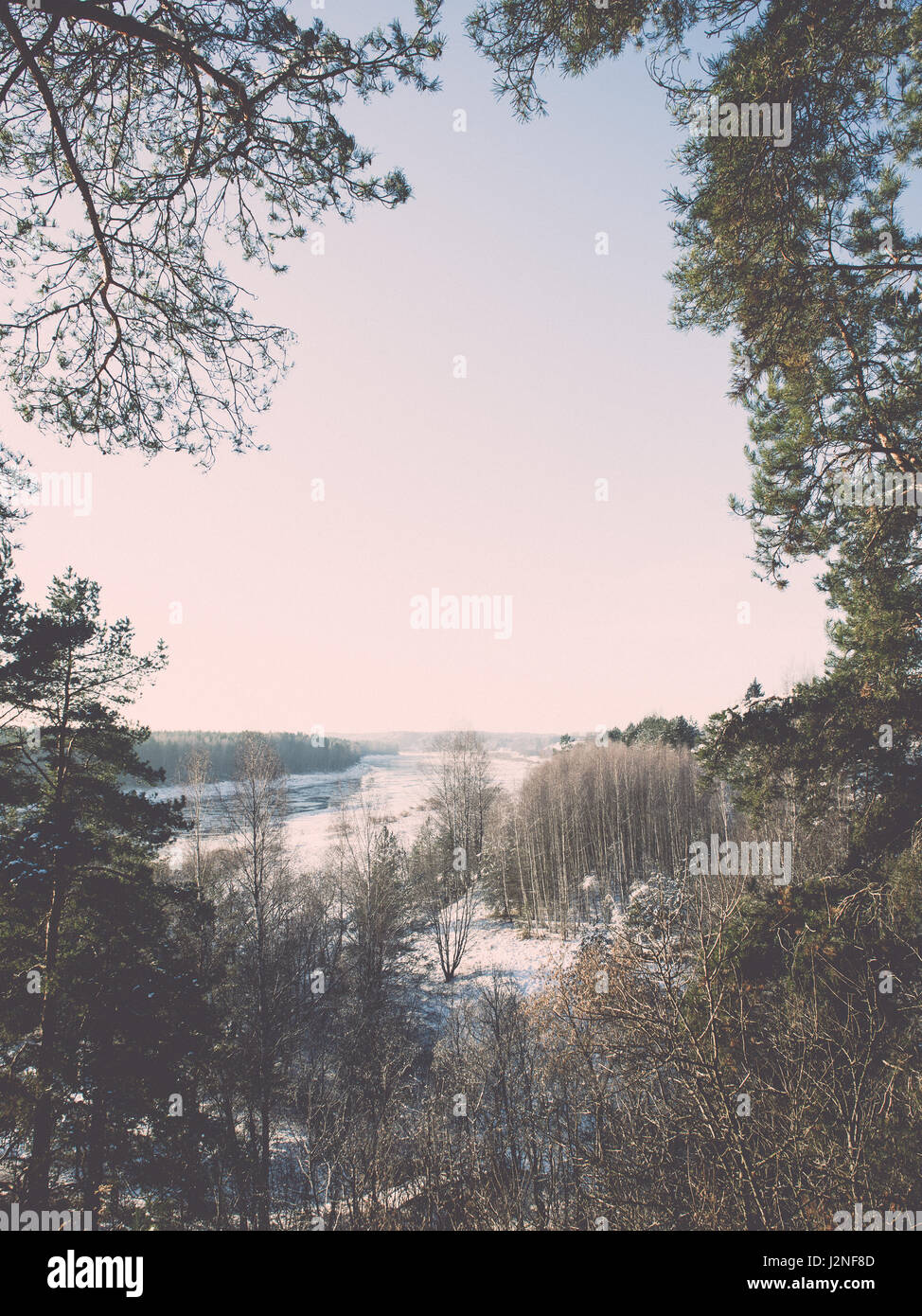 beautiful snowy winter landscape with trees and blue sky - retro ...