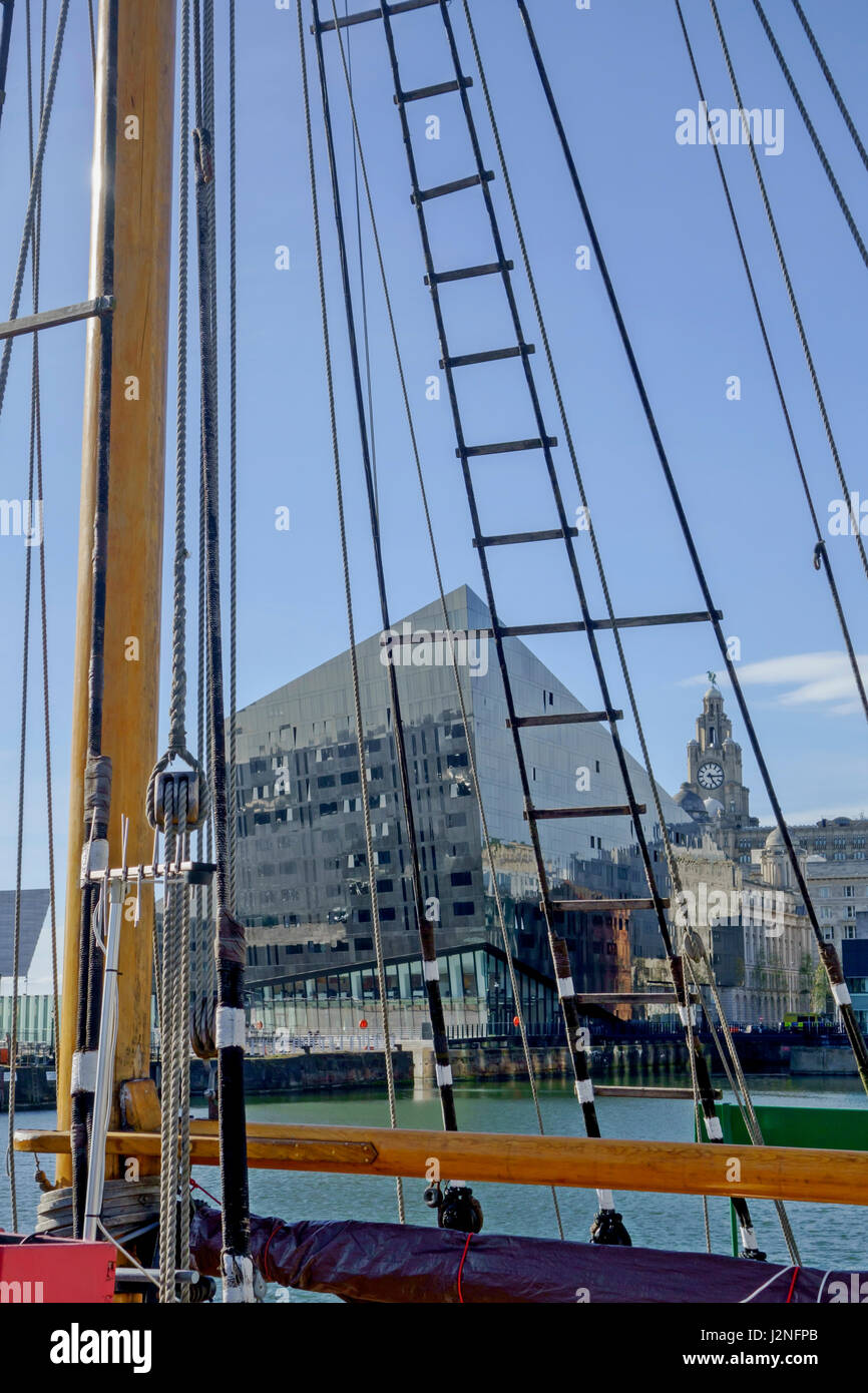 View across the Canning Dock in Liverpool, with part of old sailing ship in foreground. Stock Photo