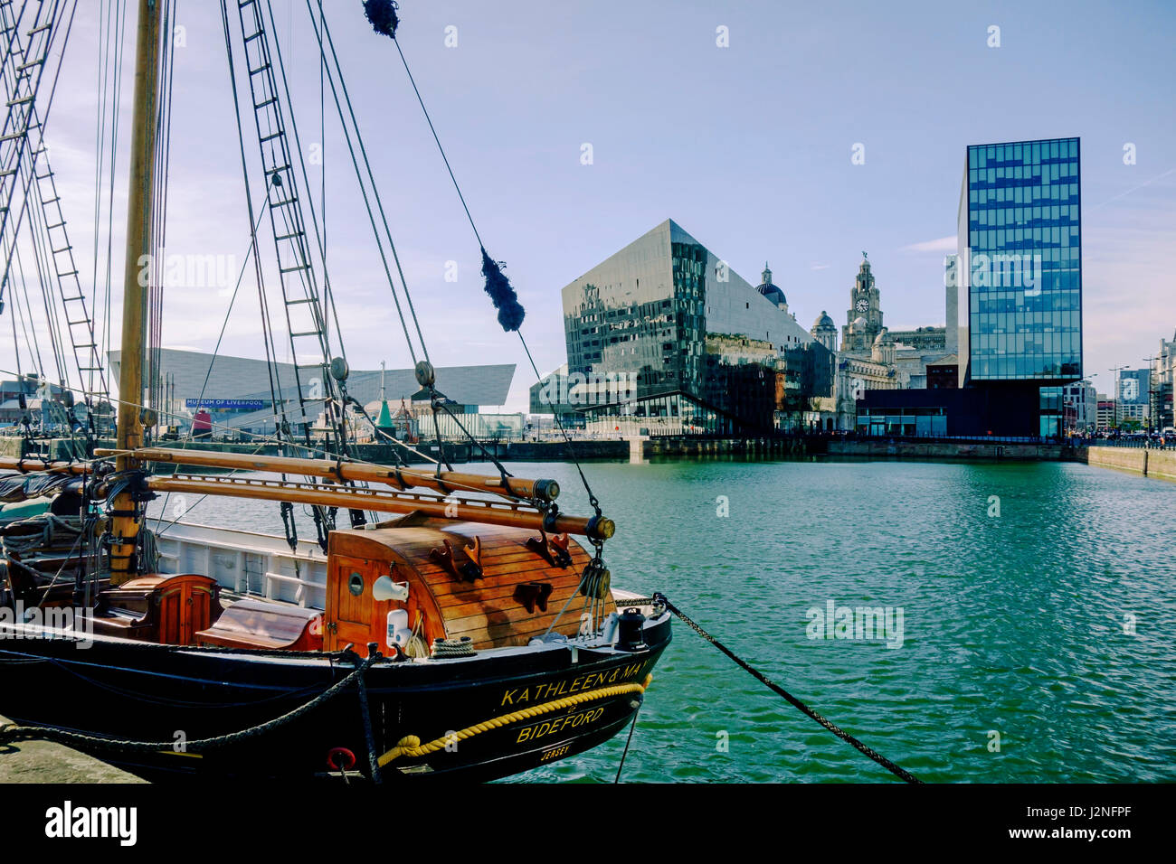 Old sailing ship in Canning Dock, Liverpool with view of modern buildings. Stock Photo