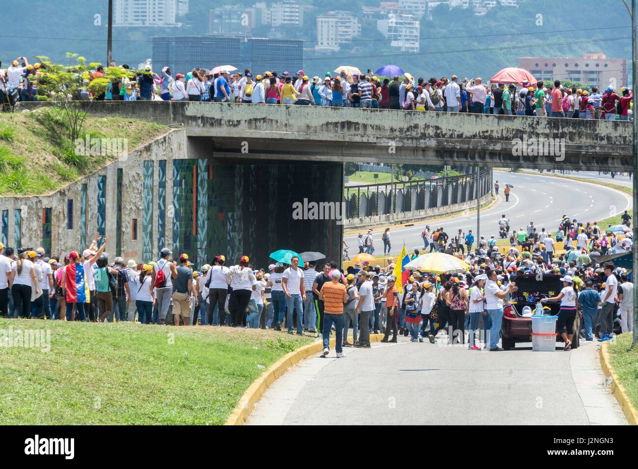 Opponents march once more through the streets and freeways of Caracas against the government of Nicolás Maduro on April 26, 2017. Stock Photo