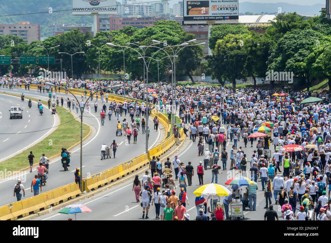 Opponents march once more through the streets and freeways of Caracas against the government of Nicolás Maduro on April 26, 2017. Stock Photo