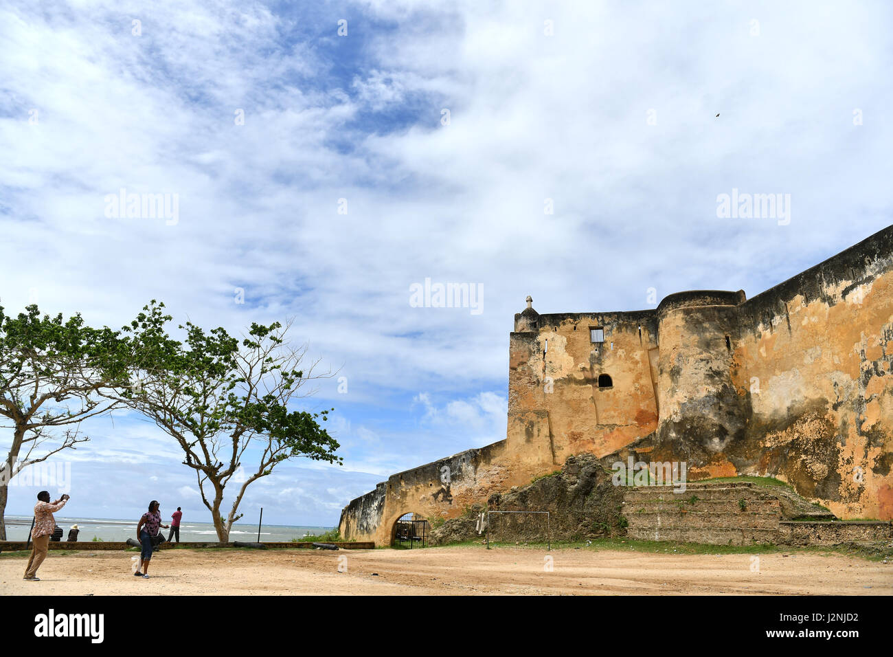 Mombasa, Kenya. 29th Apr, 2017. People take photos outside the Fort Jesus in Mombasa, Kenya, April 29, 2017. Located in the Southeastern corner of Mombasa city, Fort Jesus was built by Portuguese colonists between 1593 and 1596. Fort Jesus is one of the most outstanding and well preserved examples of 16th Portuguese military fortifications and the UNESCO added the the fort to World Heritage List as a cultural site in 2011. Credit: Sun Ruibo/Xinhua/Alamy Live News Stock Photo