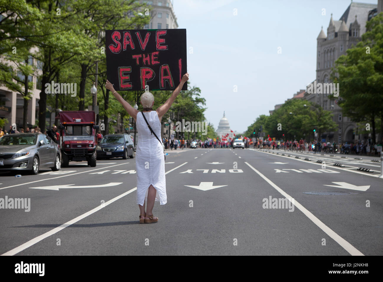 Washington, DC, USA, 29th Apr. 2017:  Thousands of Indigenous Americans, environmentalists, scientists, immigrants, religious, educators, and many others gather in Washington to resist against the Trump administration's 'attack' on the climate, air, and water during the People's Climate March. Pictured: Woman holding 'Save the EPA' sign. Credit: B Christopher/Alamy Live News Stock Photo