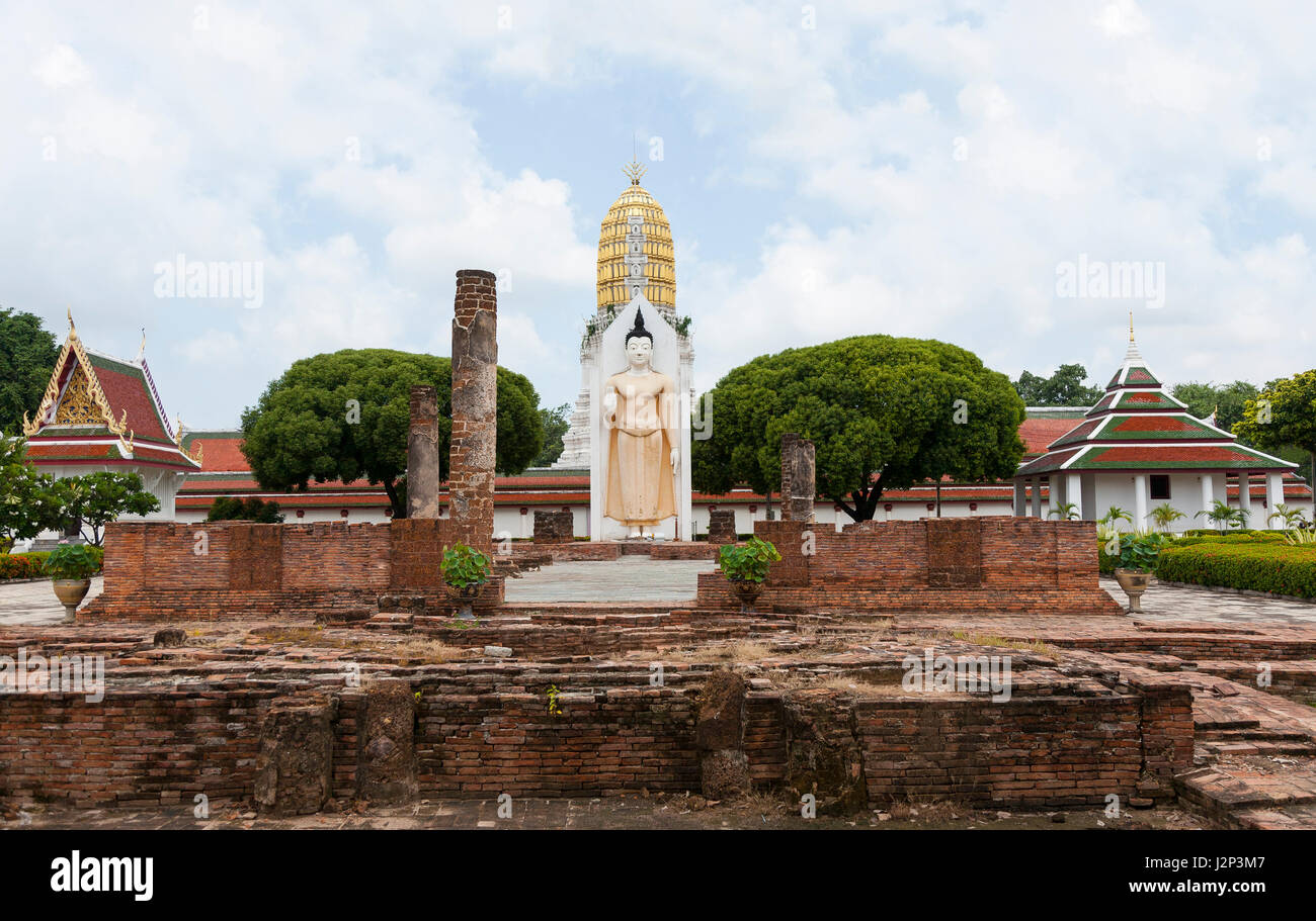 standing buddha statue at a famous temple in Phitsanulok, Thailand Stock Photo