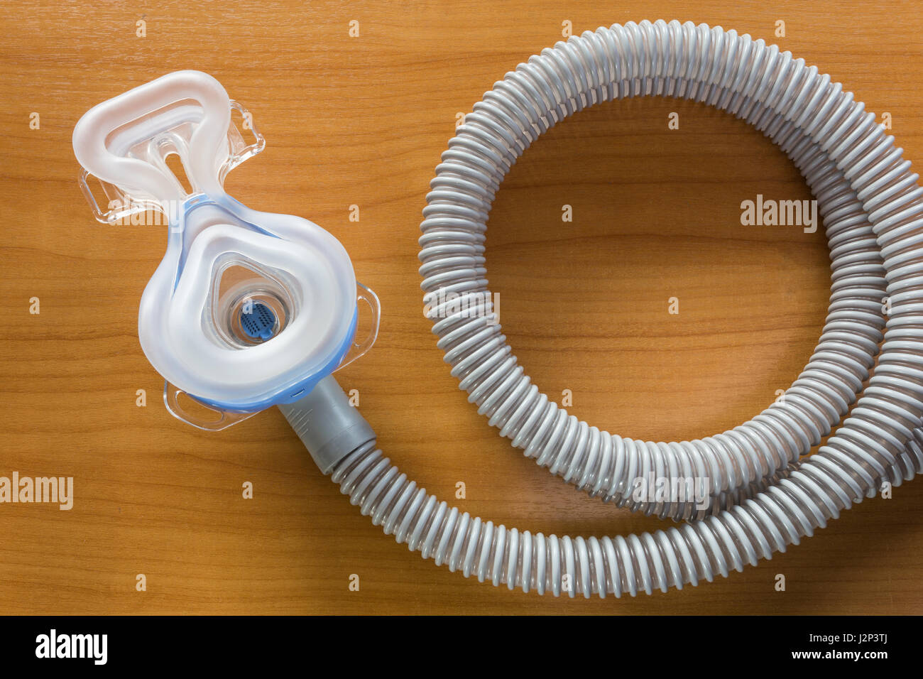 CPAP mask attaching to the air hose , use with CPAP machine to help