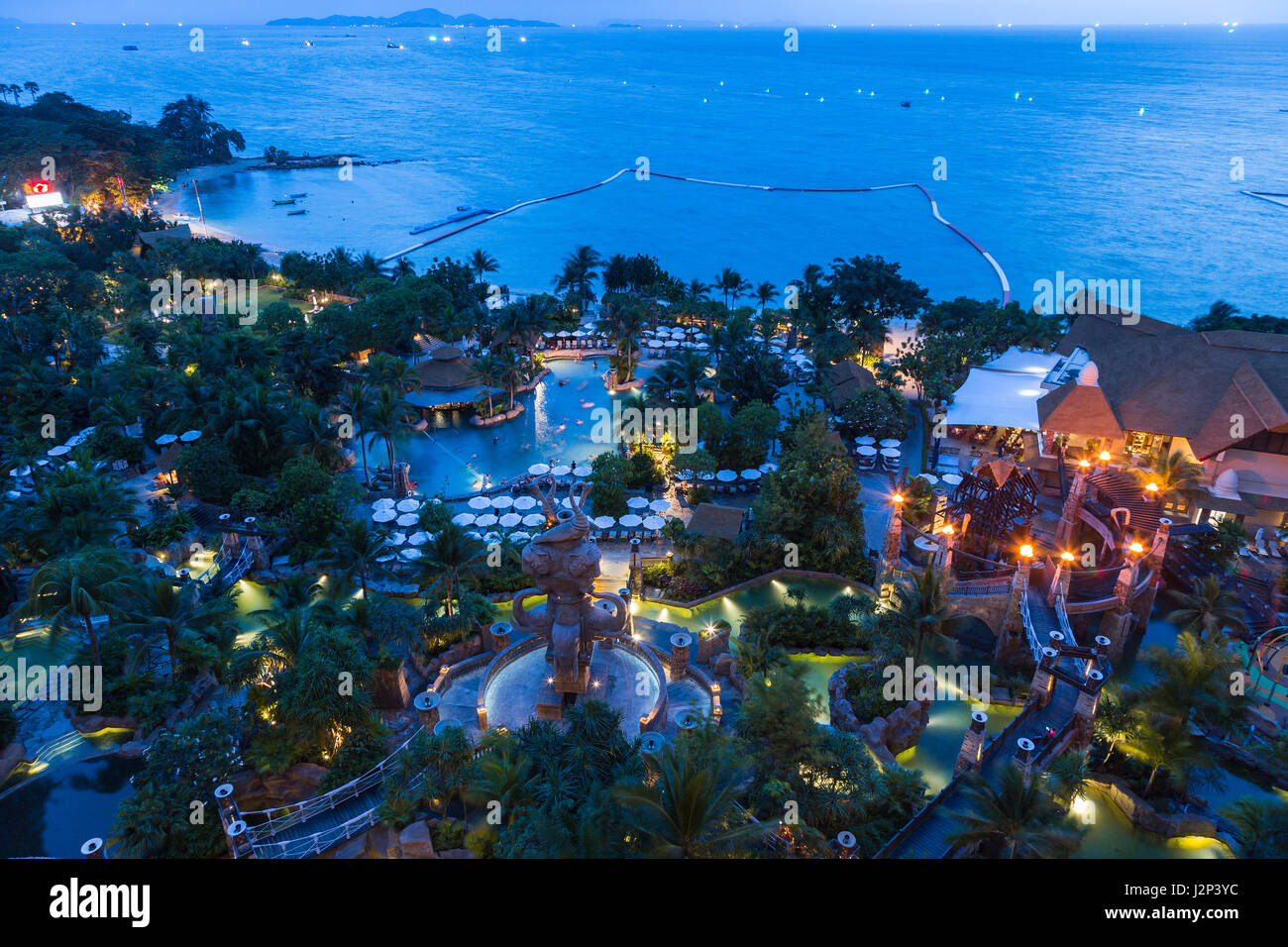PATTAYA, THAILAND - 22 October 2016 - Aerial view of Grand Mirage hotel's water park and the ocean after sunset shows its beautiful design, in Pattaya Stock Photo