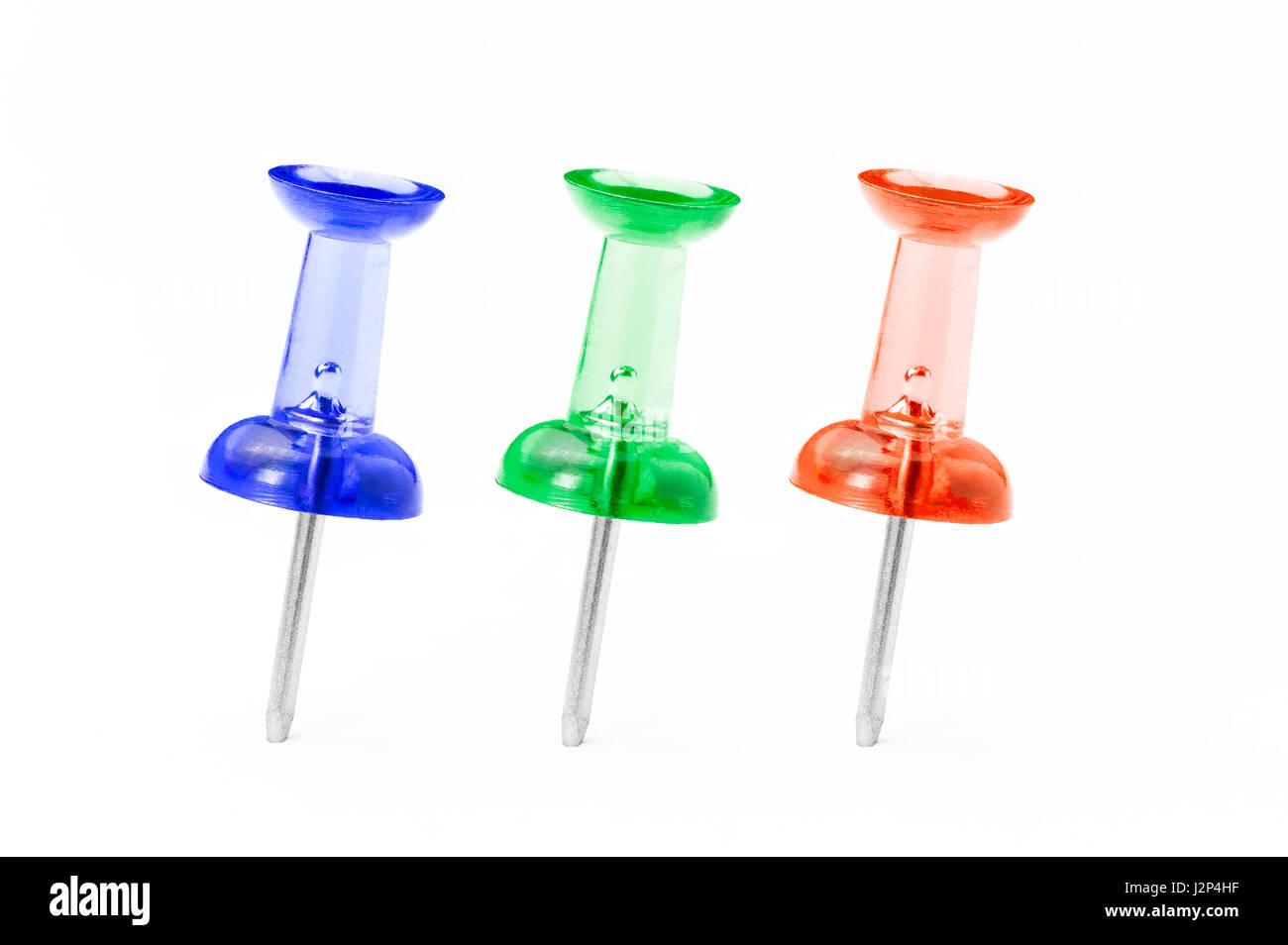 Red, Green, and Blue translucent push pins line up on white background, good for showing idea of primary colors of light Stock Photo