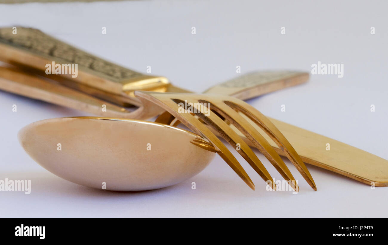 Thai gold knife, fork and spoon Stock Photo Alamy