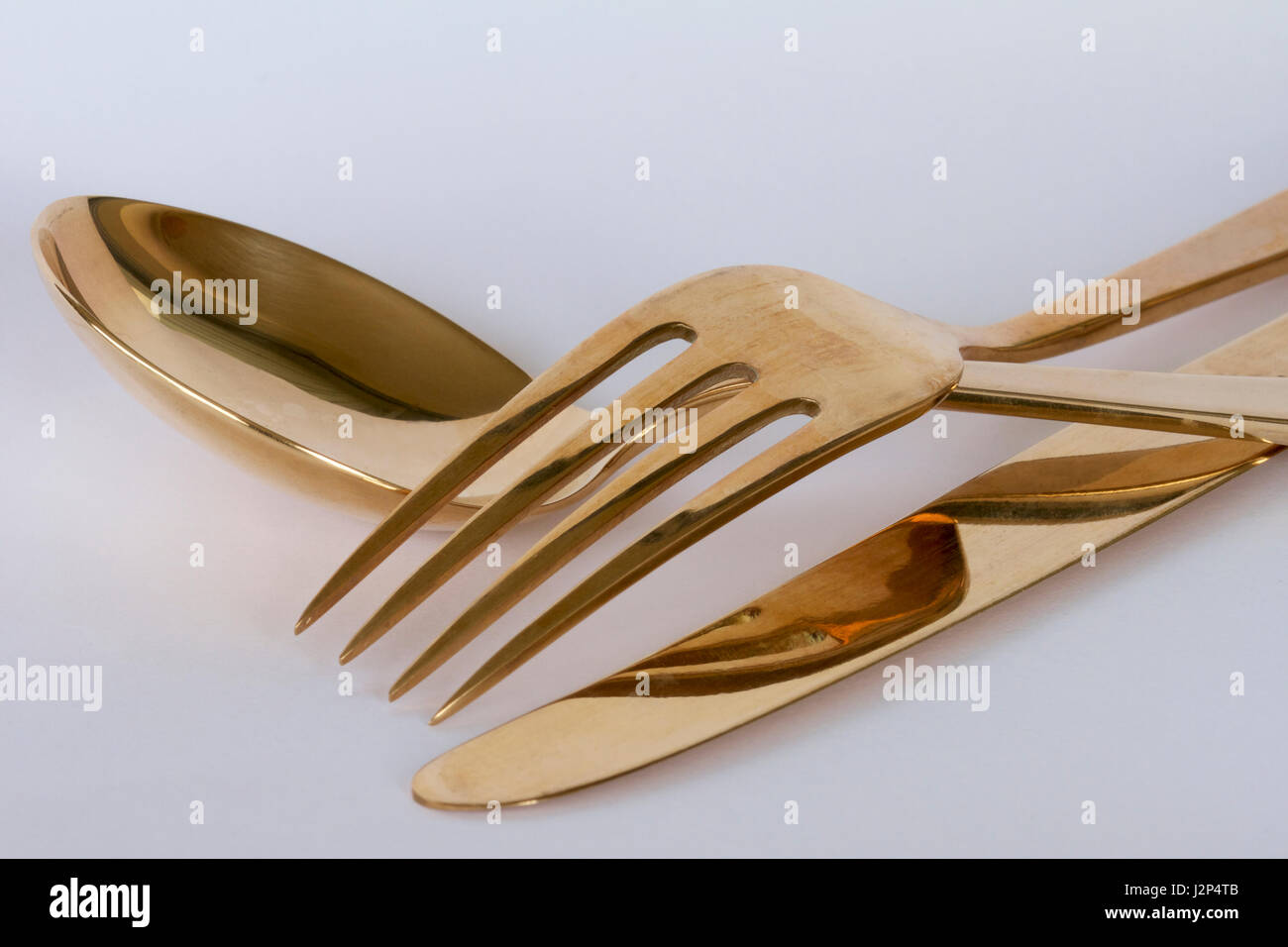 Thai gold knife, fork and spoon Stock Photo Alamy